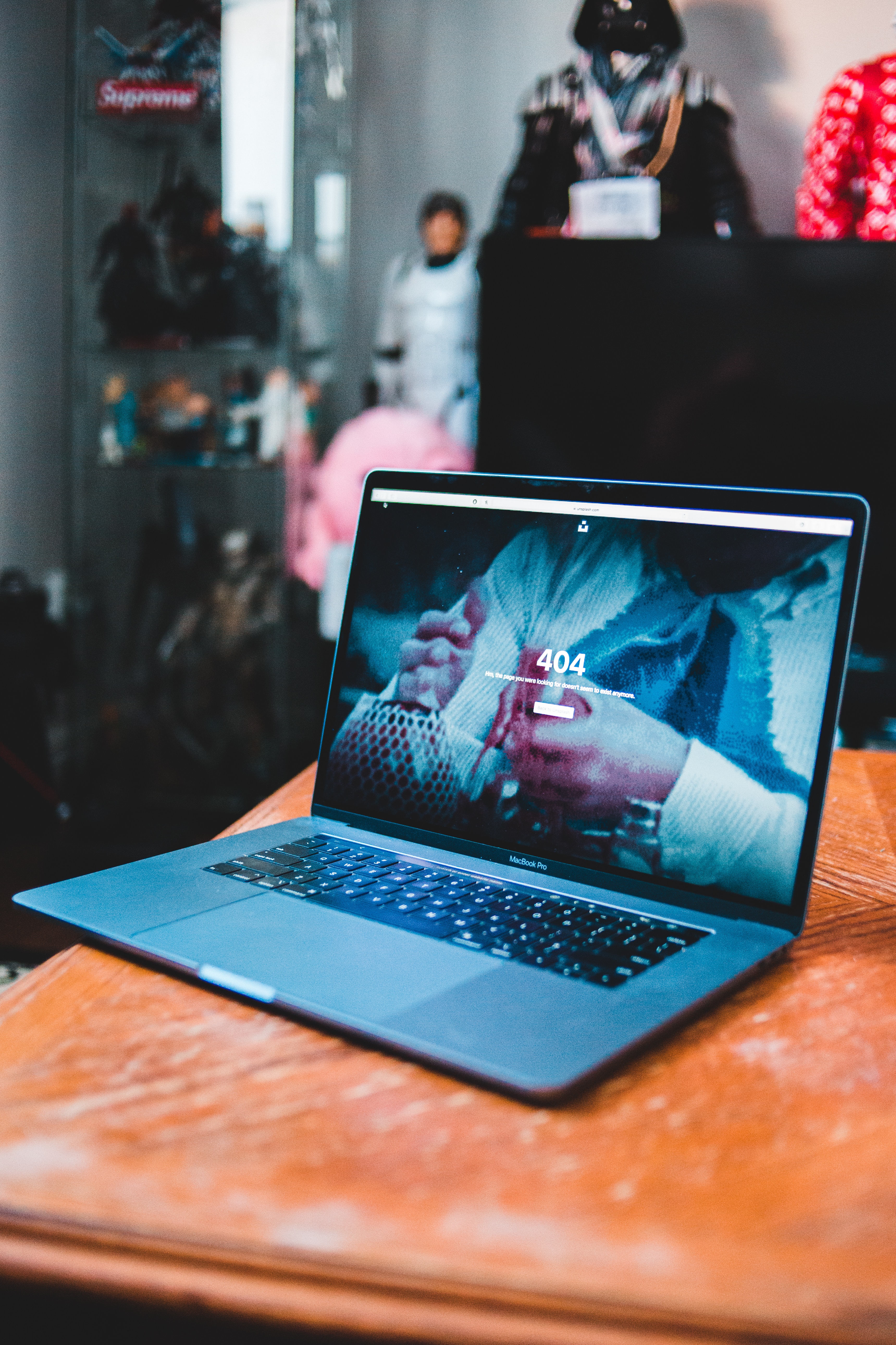 laptop on a brown desk